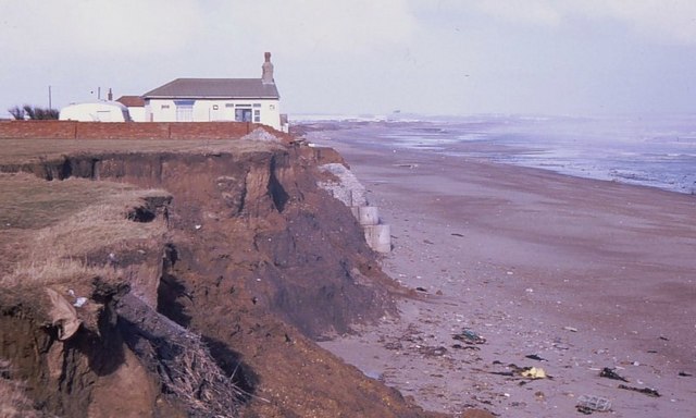 A house at the edge of an eroding cliff on the Holderness coast.